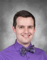 David Marques is wearing a purple dress shirt